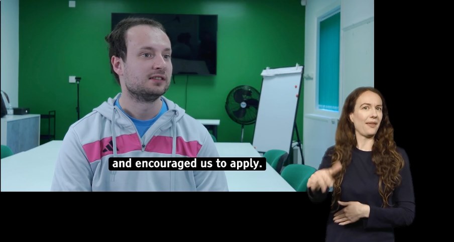 Still from a Difference North East film about disabled people's access to employment, showing a man being interviewed alongside a British Sign Language interpreter.